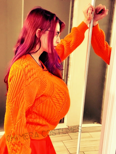 Chimera Costumes reimagines Velma from Scooby-Doo in a busty cosplay—an iconic character with a touch of sassy sophistication. 