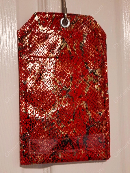 A dragon-themed badge holder showcasing detailed scales and textures, accented by a variety of colorful sci-fi patterns.