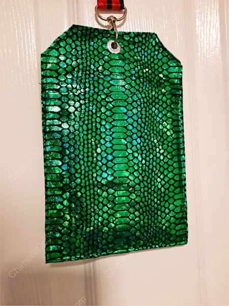 A visually appealing badge holder adorned with dragon scale-inspired patterns against a backdrop of nerdy sci-fi fabrics.