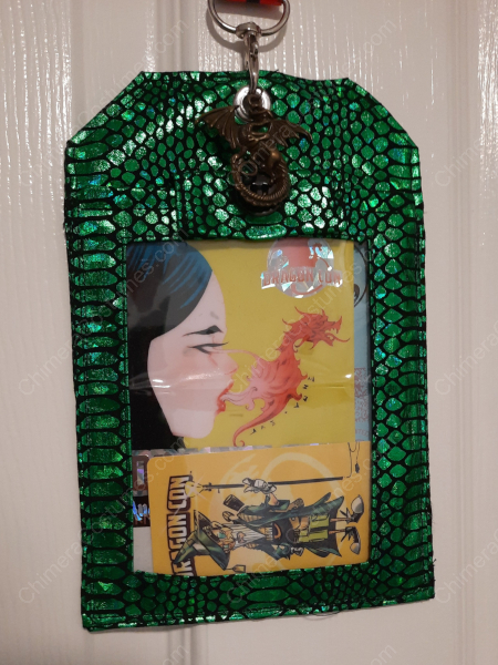 A badge holder featuring captivating designs including dragon scales and nerdy sci-fi patterns, creating an eye-catching accessory.