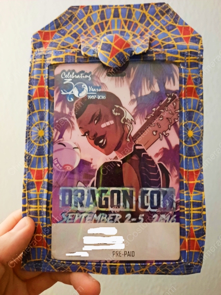 A badge holder showcasing an imaginative fusion of dragon scale patterns and nerdy sci-fi themes, creating a unique visual appeal.