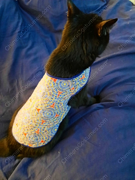 A unique garment showcasing a fusion of feline motifs and the distinctive Marriott carpet pattern, a must-have for fans of both cats and convention culture.